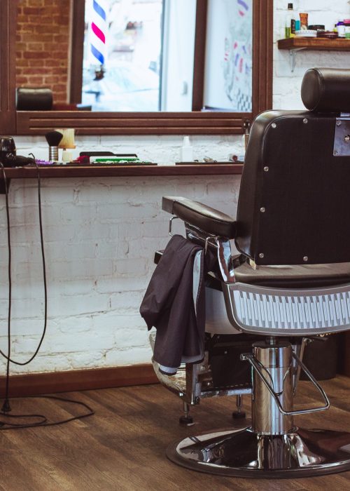 Vintage chair and interior in stilish barbershop